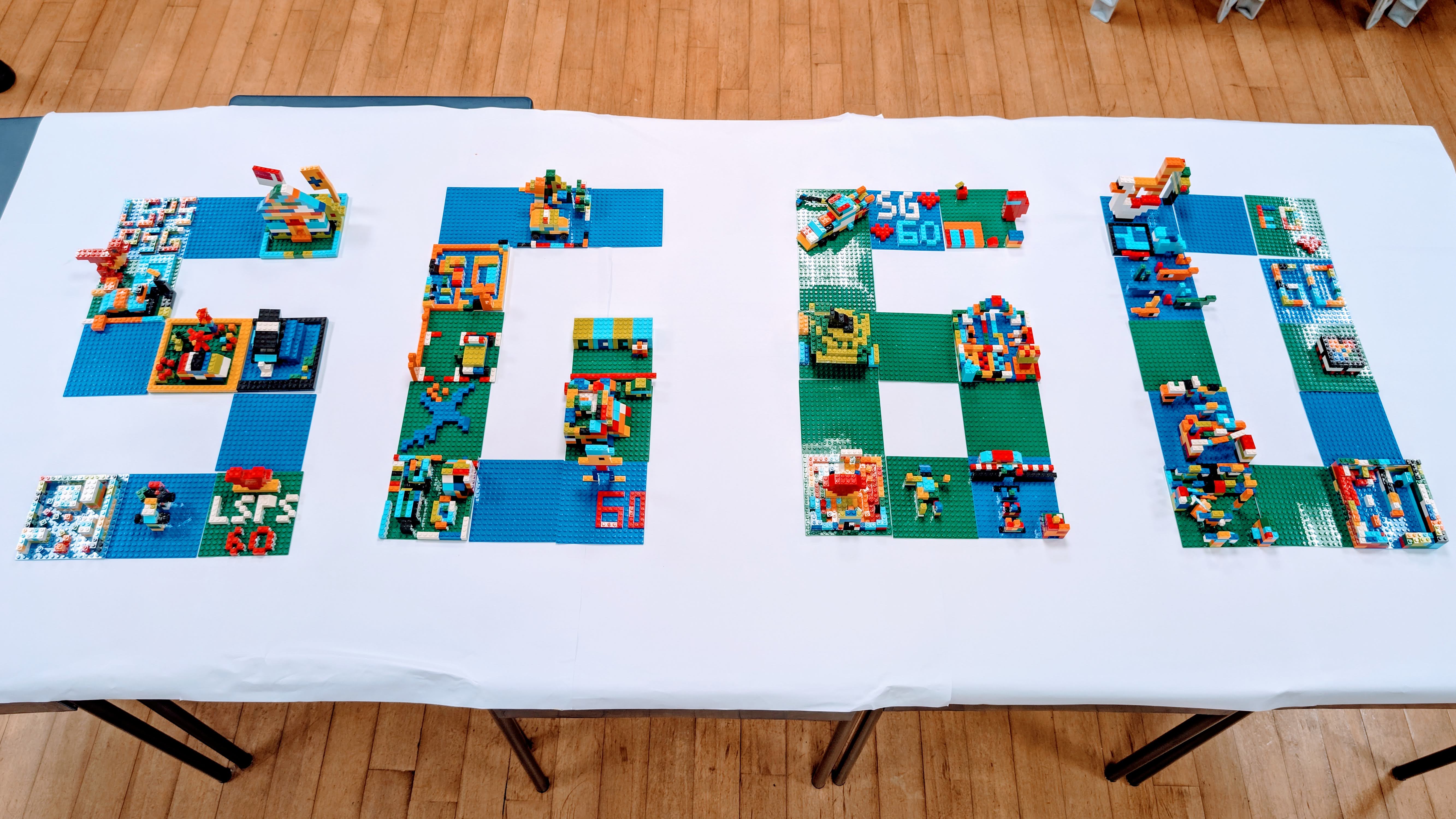 A compilation of brick art done by the workshop participants placed beautifully on a SG60 canvas